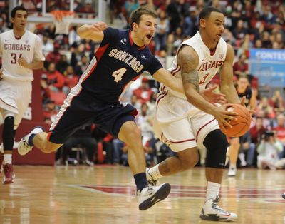 Gonzaga’s Kevin Pangos, left, tries to steal the ball from WSU’s DaVonte Lacy in a game last December. (Tyler Tjomsland)