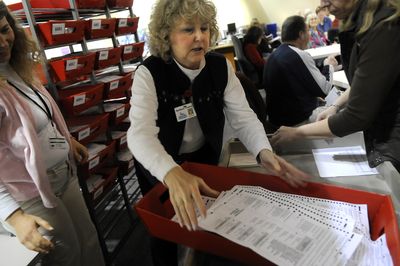 Spokane County Elections Supervisor Juli Boone handles a tray of ballots in December 2008. (File / The Spokesman-Review)