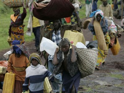 People leaving a refugee camp in eastern Congo are among thousands fleeing from the fighting.  (Associated Press / The Spokesman-Review)