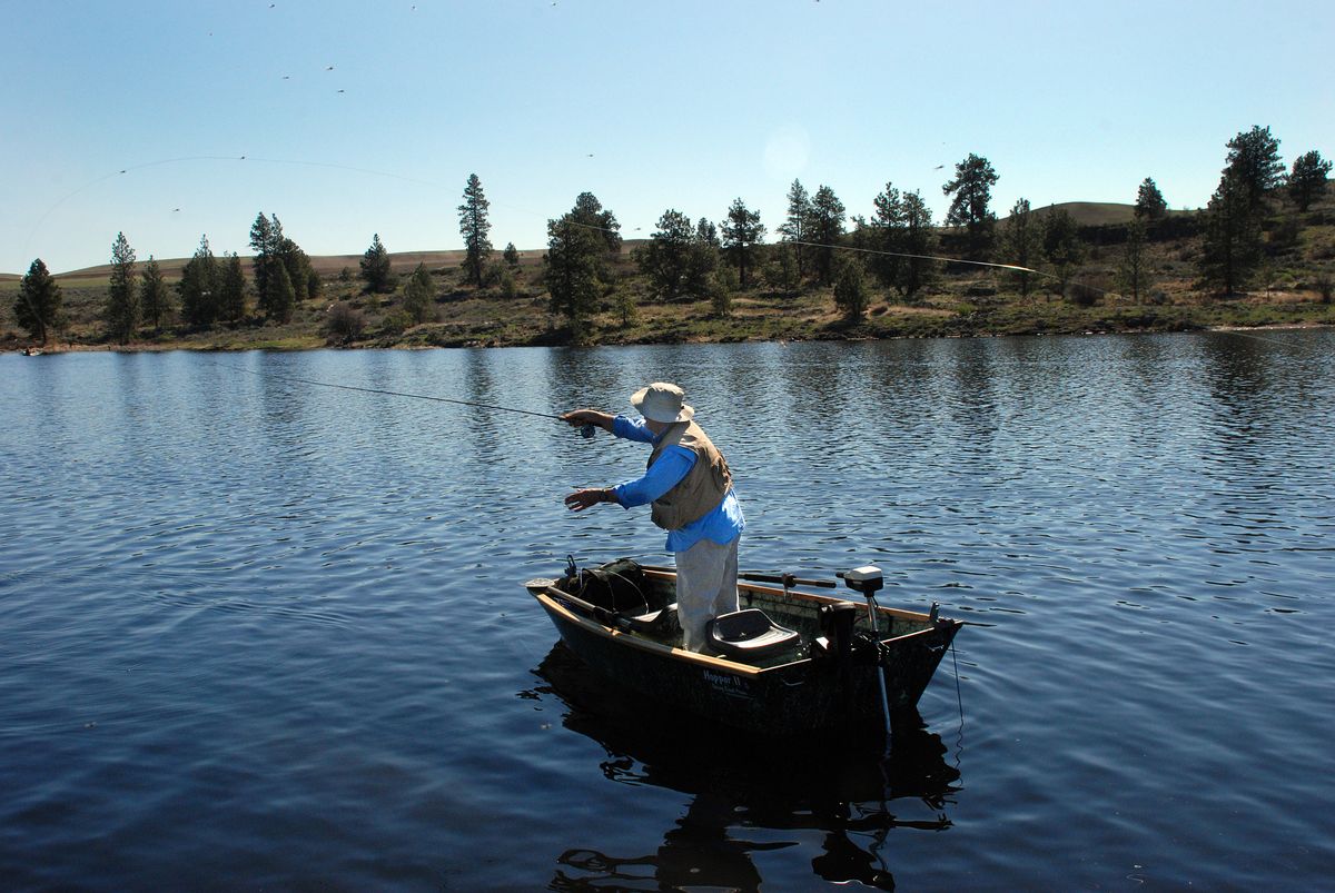 Frank Slak of Spokane is fly fishing for trout from the Hopper II model of Spring Creek Prams, a family business based near Tonasket. (Photos by RICH LANDERS / The Spokesman-Review)