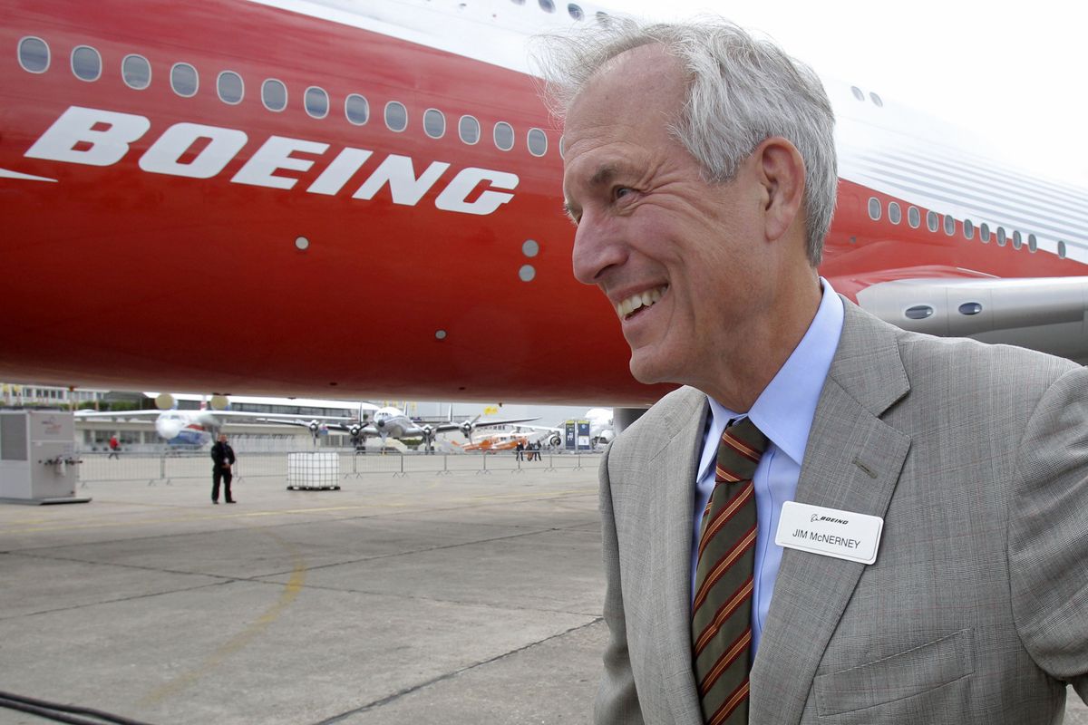 Boeing CEO Jim McNerney walks past a Boeing 747-8 jetliner at the Paris Air Show, in Le Bourget, east of Paris, on Sunday. The biennial Paris Air Show opened Monday. (Associated Press)