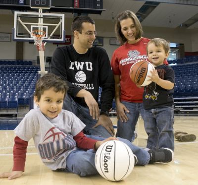 Craig Fortier and Lisa Mispley Fortier, shown with their children Marcus, left, and Calvin, right, are both basketball coaches. He at Eastern and she with the Gonzaga women.  (Jesse Tinsley / The Spokesman-Review)