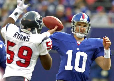 
Quarterback Eli Manning has led the New York Giants to five consecutive wins and a two-game lead in the NFC East. 
 (Associated Press / The Spokesman-Review)