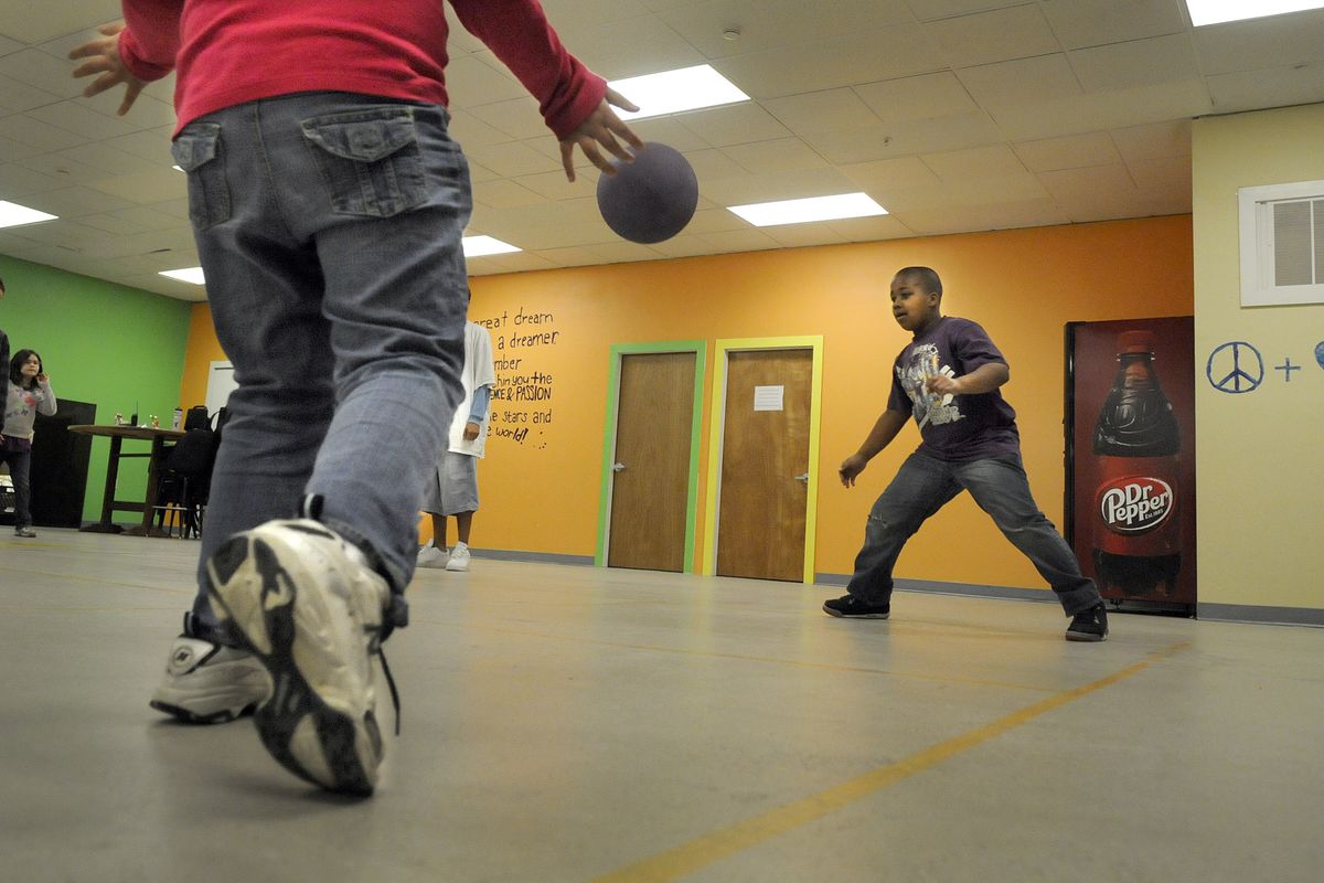 Kids play foursquare at the North East Youth Center earlier this month. The before- and after-school child care program has felt the state’s cuts in child care subsidies. (Christopher Anderson)