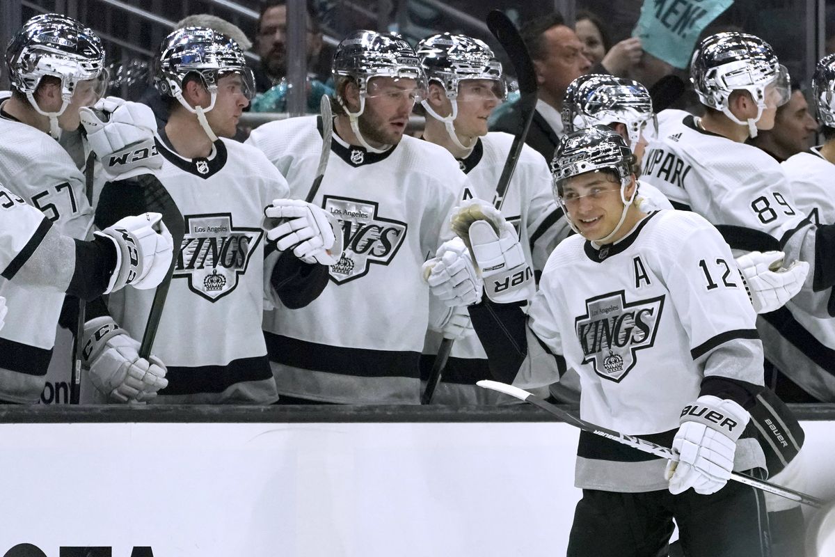 Los Angeles Kings center Trevor Moore (12) is congratulated by teammates after his goal against the Seattle Kraken during the second period of an NHL hockey game, Wednesday, April 27, 2022, in Seattle.  (Ted S. Warren)