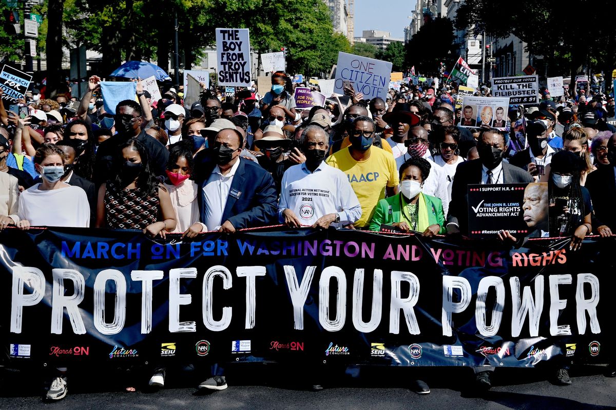 Last August, Martin Luther King III, center left, and the Rev. Al Sharpton, center, led a march in D.C. coinciding with the anniversary of the 1963 March on Washington, D.C.  (Michael S. Williamson/The Washington Post)