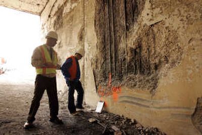 
Officials inspect interior walls Monday of a truck tunnel that runs beneath Interstate 5 in Santa Clarita, Calif., where a  fiery  crash  killed at least three Friday night. Associated Press
 (Associated Press / The Spokesman-Review)