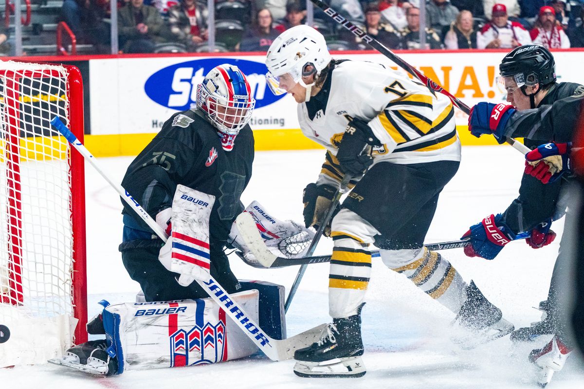 Spokane Chiefs goalie Linus Vieillard makes a save against Brandon Wheat Kings forward Joby Baumiller in the second period of a WHL game at the Arena on Saturday, Jan. 31, 2026.   (Larry Brunt)