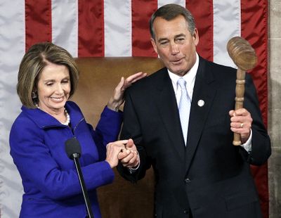 New House Speaker John Boehner takes the gavel from outgoing Speaker Nancy Pelosi on Wednesday.  (Associated Press)