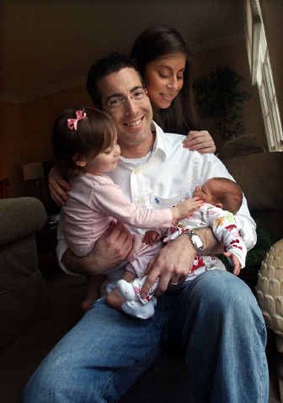 Gary and Dena Leibowitz with their daughters, Alexa, 2, and baby Dillan. Leibowitz's law firm, Saul Ewing LLP in Baltimore, allows him three months of paid paternity leave.
(Washington Post / The Spokesman-Review)