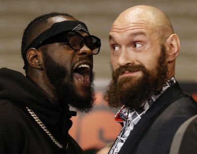 Boxers Deontay Wilder, left, and Tyson Fury exchange words as they face each other at a news conference Wednesday, Nov. 28, 2018, in Los Angeles. The pair are slated to fight Saturday night for Wilder’s WBC heavyweight title. (Damian Dovarganes / Associated Press)