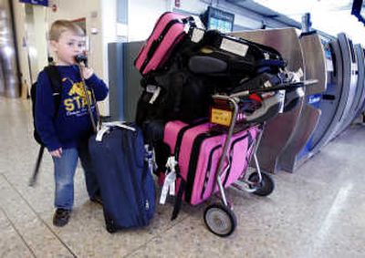 
Zachary Cunningham, 5, waits at Oakland International Airport in California after his family's ATA Airlines flight to Hawaii was canceled. Once the nation's 10th-largest airline, ATA entered bankruptcy Thursday. Associated Press
 (Associated Press / The Spokesman-Review)