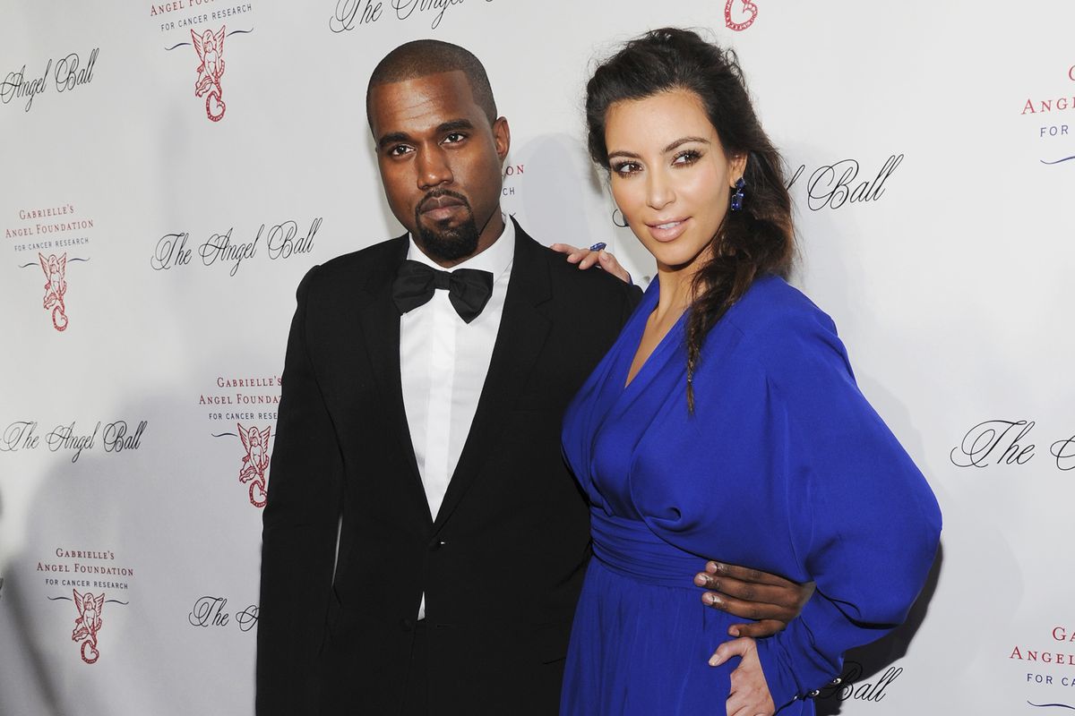 Kanye West, left, and Kim Kardashian attend Gabrielle