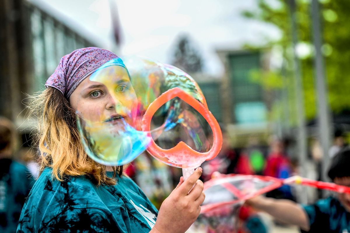 “I love them,” said Luna Ingold, 18, about the bubble station Wednesday during adaptive field day at Shadle Park High School.  (Kathy Plonka/The Spokesman-Review)