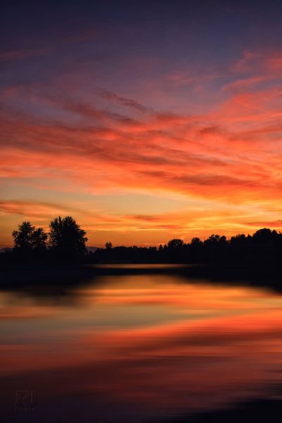 Twilight substitute for autumn trees: A majestic sunset on Spokane River near Otis Orchards.