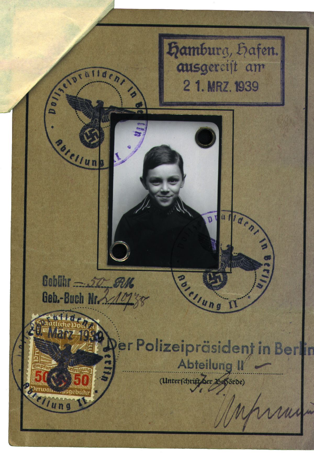 Steve Adler’s passport bears the stamps marking his exit from Germany in a pre-World War II rescue effort known as Kindertransport. Adler was 8. Now he’s 83 and lives in Seattle.