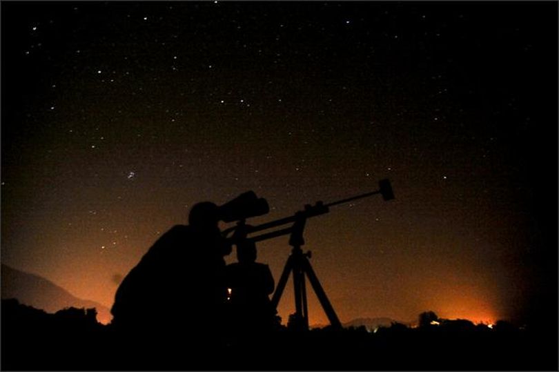 A meteor streaks towards the horizon during the annual Persied shower in Florida in August 2008. Perseid meteors are bits of debris left by the comet Swift-Tuttle which burn up in the Earth's atmosphere, and can be seen during clear skies in August, all around North America.
Photograph by: Doug Murray, Reuters (The Spokesman-Review)