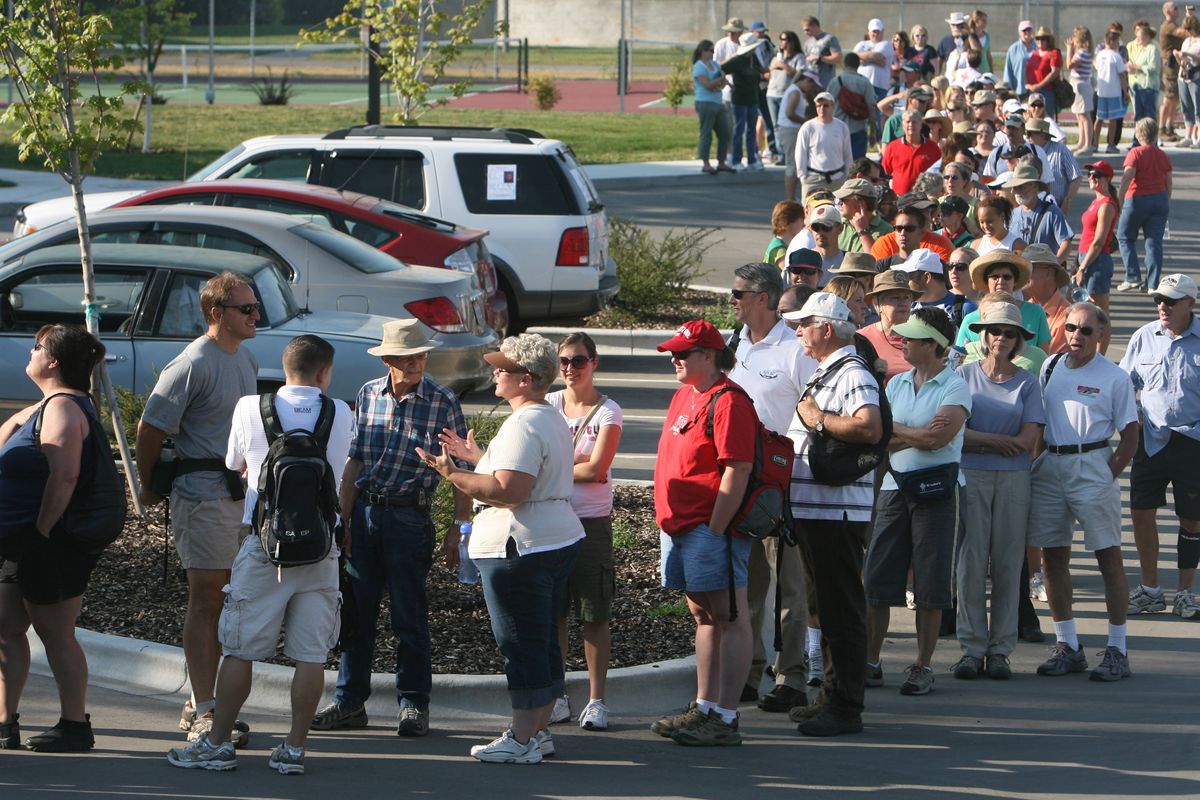 Hundreds of people wait in line Friday to register for a public search  for Robert Manwill, at South Junior High School in Boise. The 8-year-old has been missing since July 24.  (Associated Press / The Spokesman-Review)
