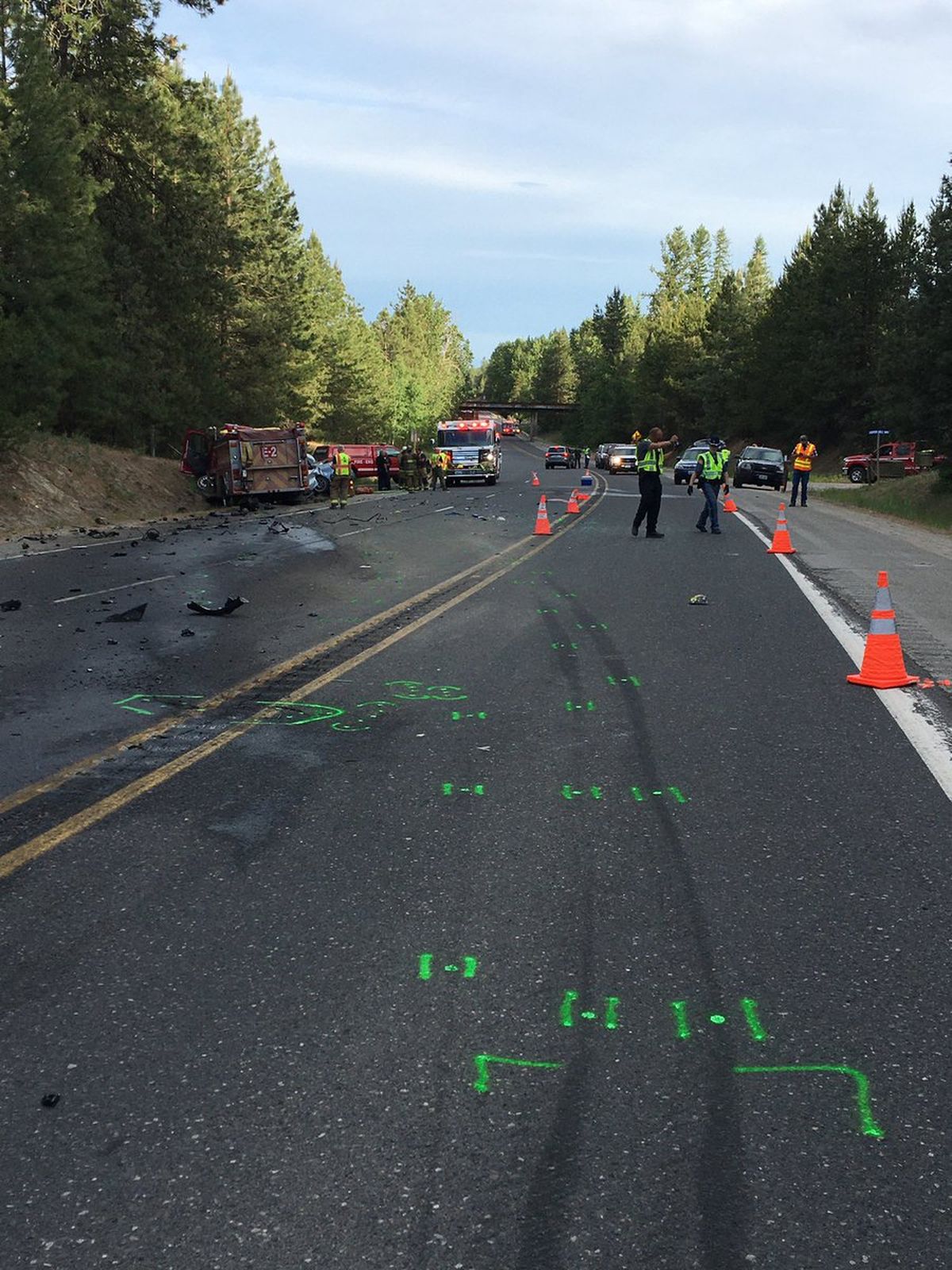 First responders are pictured at the scene of a deadly collision involving a passenger car and a fire truck along US 395 on June 7.   (Trooper Jeff Sevigney/Washington State Patrol)