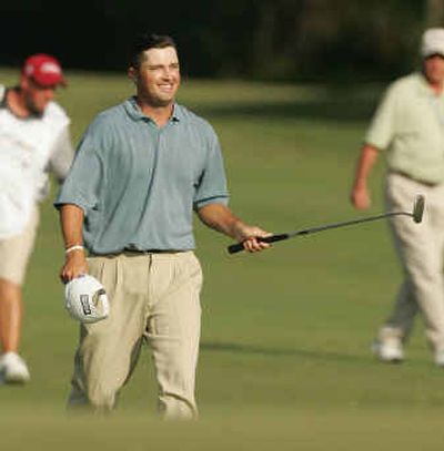 
PGA Tour rookie Ryan Palmer walks with a smile to the 18th green during the final round of the Funai Classic.
 (Associated Press / The Spokesman-Review)
