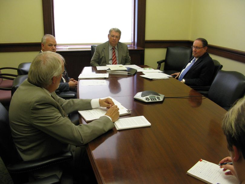 Idaho's state Board of Canvassers, consisting of state Controller Brandon Woolf, Secretary of State Lawerence Denney, and state Treasurer Ron Crane, meets Wednesday to certify the primary election results; at left is Chief Deputy Secretary of State Tim Hurst, and at right is state elections director Betsie Kimbrough. (Betsy Z. Russell)