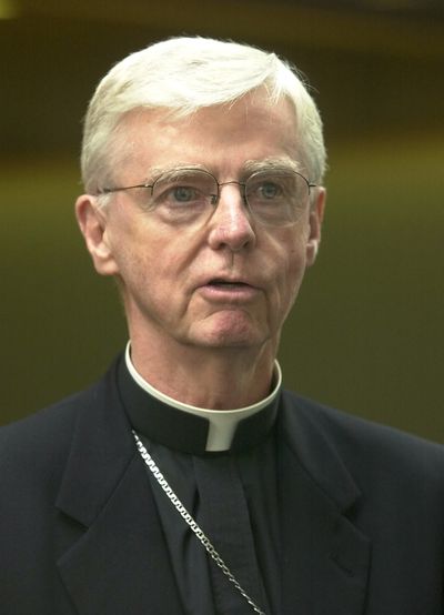 FILE – New Hampshire Bishop John McCormack speaks to reporters, in Manchester, N.H., in this Thursday, Aug. 15, 2002 file photo. McCormack, who faced criticism for his role in Boston’s clergy sex abuse scandal and led New Hampshire’s diocese during its own reckoning, has died. McCormack, 86, died Tuesday, Sept. 21, 2021, at Mt. Carmel Rehabilitation and Nursing Center in Manchester, according to the Diocese of Manchester.  (Jim Cole)