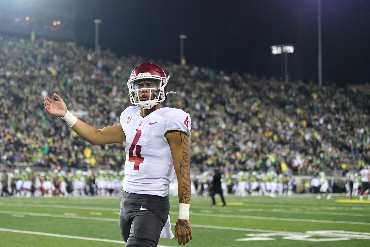 Washington State quarterback Jayden de Laura (4) gestures to fans before facing Oregon on Nov. 13 at Autzen Stadium in Eugene, Oregon.  (Tyler Tjomsland/The Spokesman-Review)