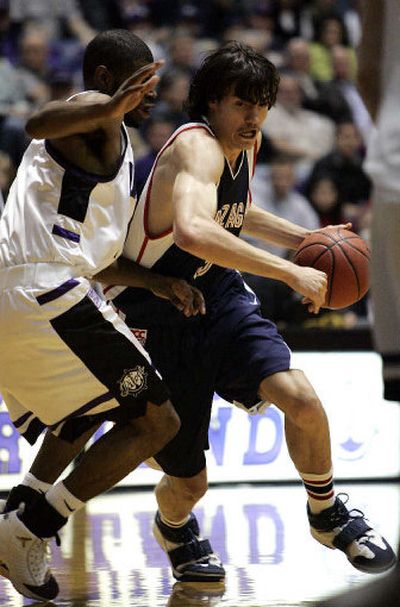 Gonzaga Bulldogs forward Adam Morrison drives by Portland guard Darren Cooper during WCC play Monday night.
 (Associated Press / The Spokesman-Review)