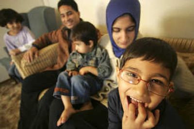 
The Murad family, from right to left, Maitham, 6, Bushara, Dyar, 2, Kamal and Mariam, 7, are seen in their Salem apartment  Nov. 21. Kamal Murad is among a small contingent of Iraqi interpreters who have been able to get the special visas required to move to the United States. Associated Press
 (Associated Press / The Spokesman-Review)