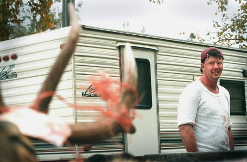 Elk hunter Scott Ricks admires his 5 X 5 bull elk, in the back of his truck, at an Idaho Game and Fish check station near the North Fork of the Coeur d'Alene River in 2011.  Ricks bagged his prize shortly after 7 a.m. (FILE The Spokesman-Review)