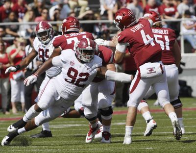 In this Oct. 6, 2018, file photo, Alabama defensive lineman Quinnen Williams puts the pressure on Arkansas quarterback Ty Storey in the second half of an NCAA college football game, in Fayetteville, Ark. The guys who have to block Quinnen Williams in practice aren’t the least bit surprised by his success on Alabama’s defensive line. Williams has emerged as a dominant force for the top-ranked Crimson Tide at nose guard, doing in games what he has often done in practice. “I think we’re honestly a little relieved as an (offensive) line that we’re like, ‘OK, no one else can block him either,’” Alabama left tackle Jonah Williams said. (Michael Woods / Associated Press)