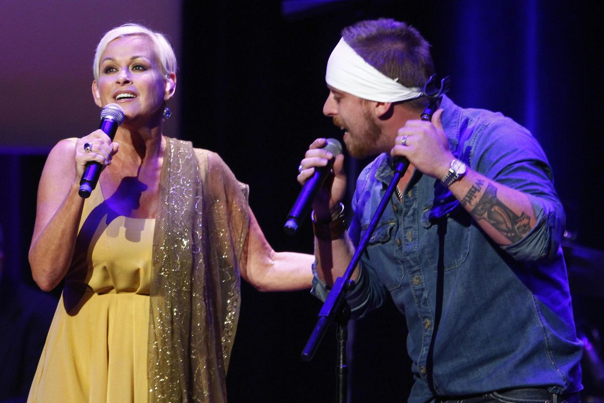 Lorrie Morgan, left, performs with her son Jesse Keith Whitley at the ACM Honors at the Ryman Auditorium on Tuesday, Sept. 10, 2013 in Nashville, Tenn. (Photo by Wade Payne/Invision/AP) ORG XMIT: TNWP133