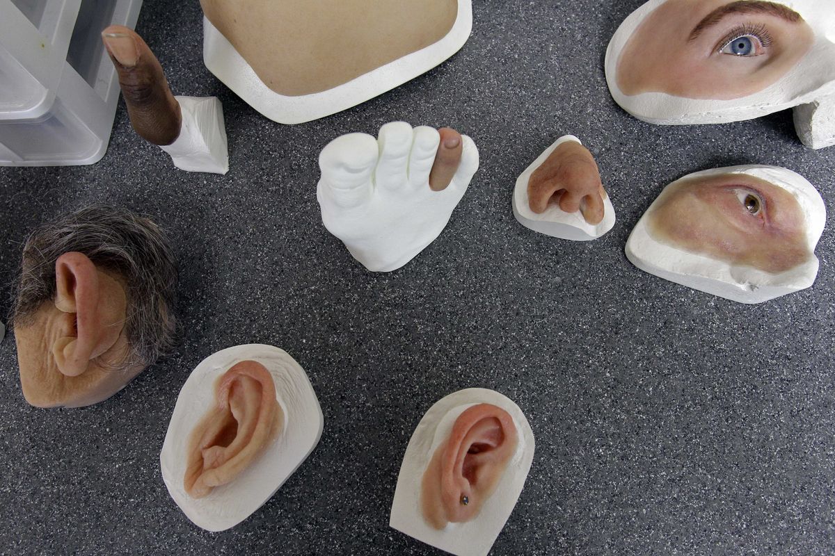 Facial prosthetics are seen at the Anaplastology Clinic in Durham, N.C. Made to counter damage from cancer, trauma and birth defects, facial prosthetics haven’t gained the attention of artificial limbs, and the specialists who craft them can be hard to find. “People who have implant-retained ears or noses or whatever usually think of them really as their own body,” says Jerry Schoendorf, who with his colleague and surgeons at nearby Duke University Medical Center, created an ear for Elise Lutz. 