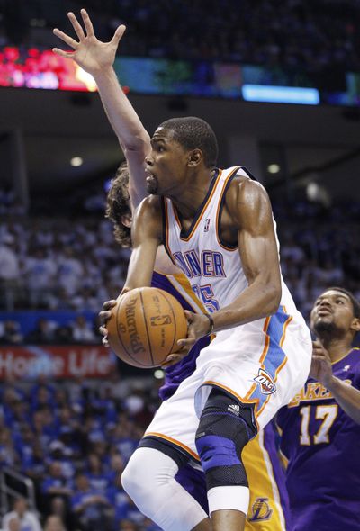 Oklahoma City’s Kevin Durant scored 22 points as Thunder rallied from seven down in final 2 minutes to beat Lakers 77-75. (Associated Press)