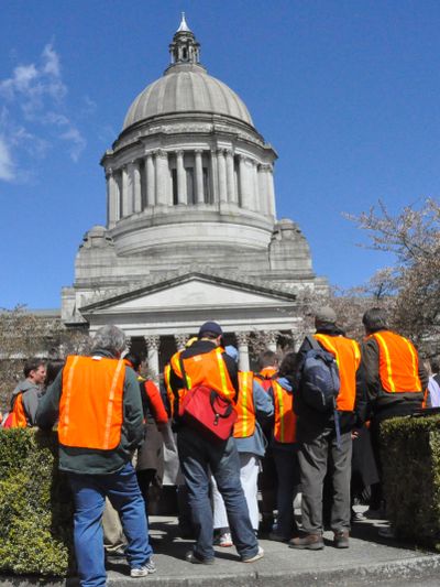 Protesters gather outside the state Capitol calling for a budget that raises some taxes rather than cutting state services, on April 18, 2011 (Jim Camden/The Spokesman-Review)