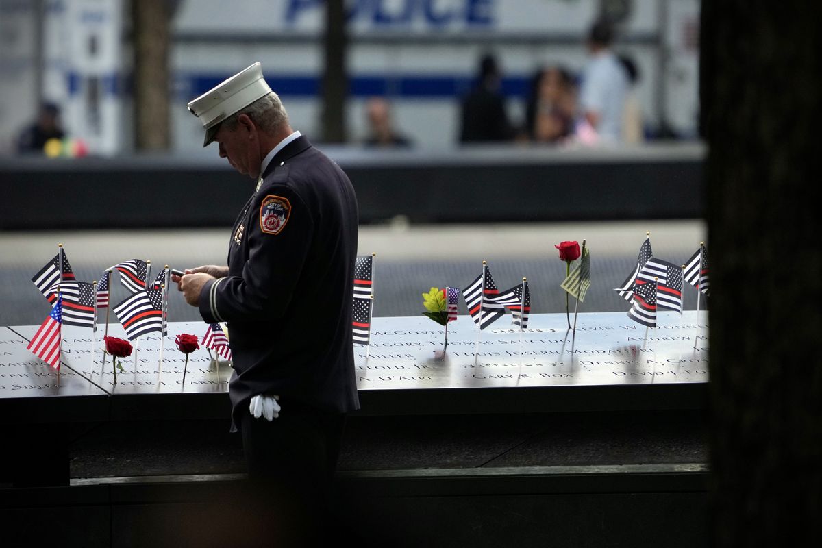 A New York City firefighter reflects during a ceremony to mark the 22nd anniversary of the terror attack on the World Trade Center.  (MAANSI SRIVASTAVA)
