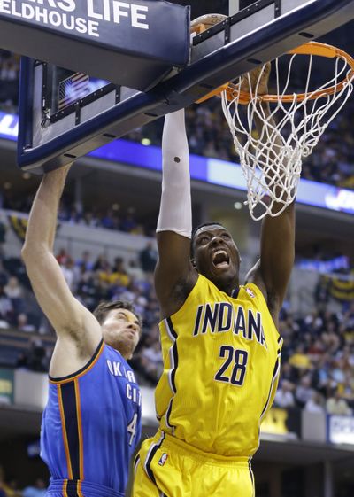 Indiana’s Ian Mahinmi gets past Thunder forward Nick Collison for two of his 11 points off the bench. (Associated Press)
