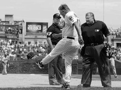 Cubs manager Lou Piniella pleads his case with the umpires before being ejected.
(Associated Press / The Spokesman-Review)