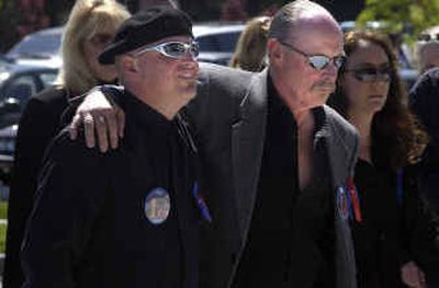 
Steve V. Groene, right, supported by a friend, prepares to enter Real Life Ministries, a church in Post Falls, before the funeral for his ex-wife Brenda and son Slade on Wednesday. 
 (Jesse Tinsley / The Spokesman-Review)
