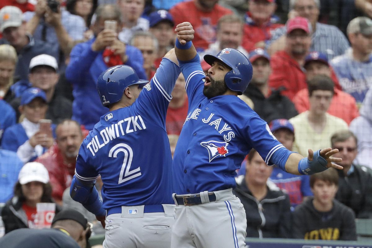 Toronto’s Troy Tulowitzki (2) and Jose Bautista, right, celebrate Tulowitzki’s two-run home run that scored Bautista in the second inning of Game 2 of the American League Division Series against the Texas Rangers on Friday. (David J. Phillip / Associated Press)