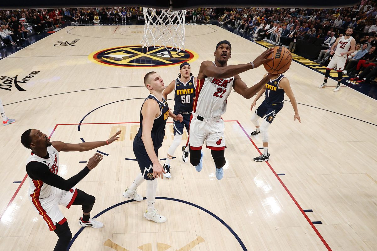 DENVER, COLORADO - JUNE 04: Jimmy Butler #22 of the Miami Heat drives to the basket against Nikola Jokic #15 of the Denver Nuggets during the first half in Game Two of the 2023 NBA Finals at Ball Arena on June 04, 2023 in Denver, Colorado. NOTE TO USER: User expressly acknowledges and agrees that, by downloading and or using this photograph, User is consenting to the terms and conditions of the Getty Images License Agreement. (Photo by Matthew Stockman/Getty Images)  (Matthew Stockman)