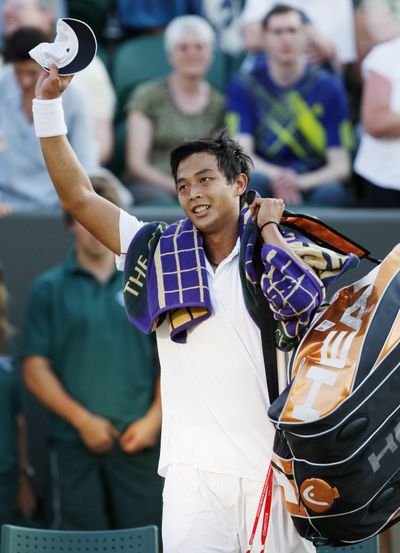 Taiwan's Lu Yen-Hsun celebrates upset win over Andy Roddick. (Associated Press)
