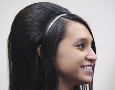Suzie Barrera, of Idaho Falls, likes a hairdo with volume. But she also likes to give it a break: Barrera swore off the pouf for a while for her New Year’s resolution, worried her mane was hurt by daily ratting and spraying. (Associated Press)