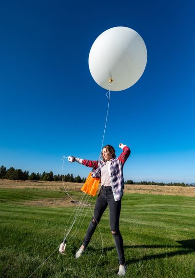 Rachael Fewkes, a general meteorologist at the Spokane office of the National Weather Service on North Rambo Road, releases a weather balloon on Monday. The local weather service usually releases two weather balloons each day, but it has been releasing four a day since Saturday to assist in the forecasting of Hurricane Ian. The weather service reported later Monday that the balloon popped when it was 113,054 feet high and landed about 15 miles north of Kellogg, Idaho, Cote said. The temperature at the balloon’s highest altitude was minus-80.5 Fahrenheit.  (COLIN MULVANY/THE SPOKESMAN-REVIEW)