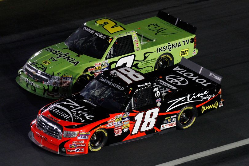 Kyle Busch and Elliott Sadler battle for position in the early stages of the North Carolina Education Lottery 200 at Charlotte Motor Speedway. (Photo courtesy of Jason Smith/Getty Images) (Jason Smith / Getty Images North America)