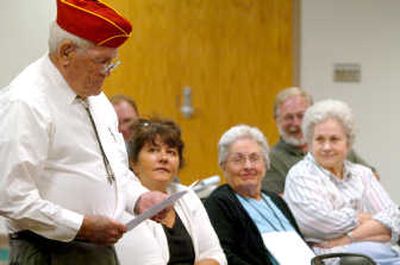 
Rick Seward, left, of the Marine Corps League speaks at the Kootenai County Commission meeting Tuesday, where the commissioners voted to rename the Coeur d'Alene Airport to Coeur d'Alene Airport/Pappy Boyington Field. The rest of the audience includes, from left, Kerri Thoreson, Colleen Allison and Alice Rankin. Boyington, a Medal of Honor recipient and WWII flying ace, was born in Coeur d'Alene and led the famous Black Sheep Squadron.
 (Jesse Tinsley / The Spokesman-Review)