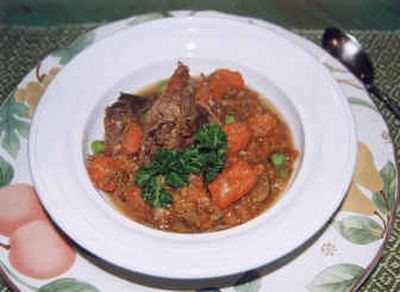 
 A plate of Tasty Pot Roast, a classic and economical comfort food, is made with beef chuck. After careful cooking, the beef is meaty-tasting, moist and pull-apart tender. The vegetables have a robust flavor and are well cooked but not mushy. 
 (Associated Press / The Spokesman-Review)