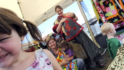 Moms Manda Warner, kneeling, and Jaclyn Clarry of Coeur d’Alene make quilts, diaper bags and other accessories through their home-based business, Monkey on the Moon. Their children, from left front, are Kiki Warner, 4, Kali Warner, 2, Natalee Clarry, 8 weeks, and Tristan Clarry, 20 months.  (Kathy Plonka / The Spokesman-Review)
