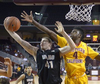 Idaho forward Ty Egbert, left, and Southern California forward Chimezie Metu reach for a rebound during the second half of an NCAA college basketball game on Dec. 7, 2015, in Los Angeles. USC won 74-55. (AP Photo/Mark J. Terrill)