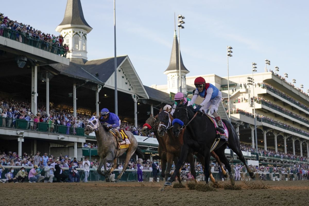 John Velazquez riding Medina Spirit, right, leads Florent Geroux on Mandaloun, Flavien Prat riding Hot Rod Charlie and Luis Saez on Essential Quality to win the 147th running of the Kentucky Derby at Churchill Downs, Saturday, May 1, 2021, in Louisville, Ky.  (Associated Press)